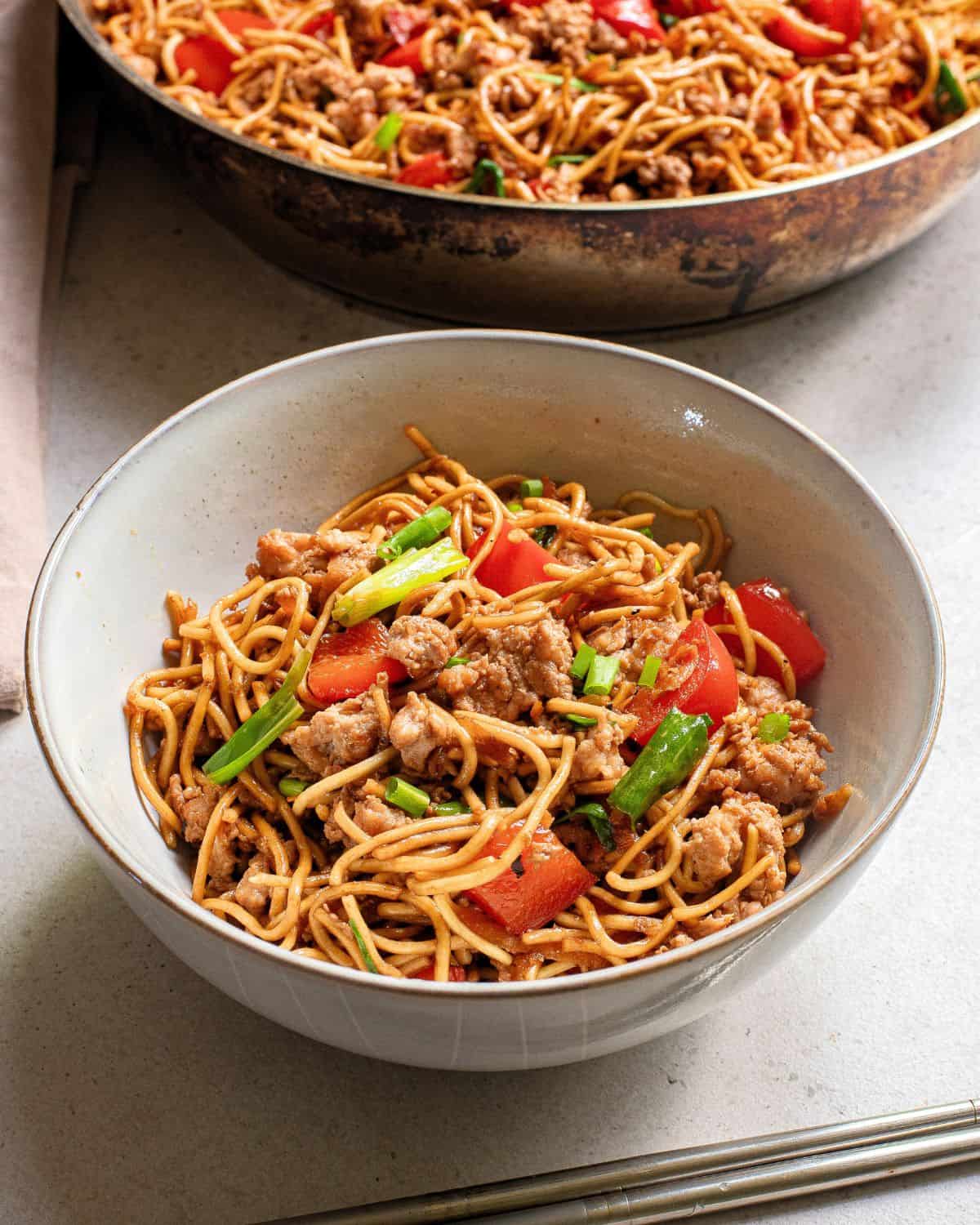 A side view of pork teriyaki noodles.