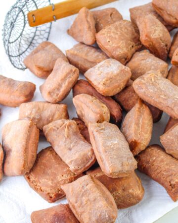 Chocolate beignets that have been fried.