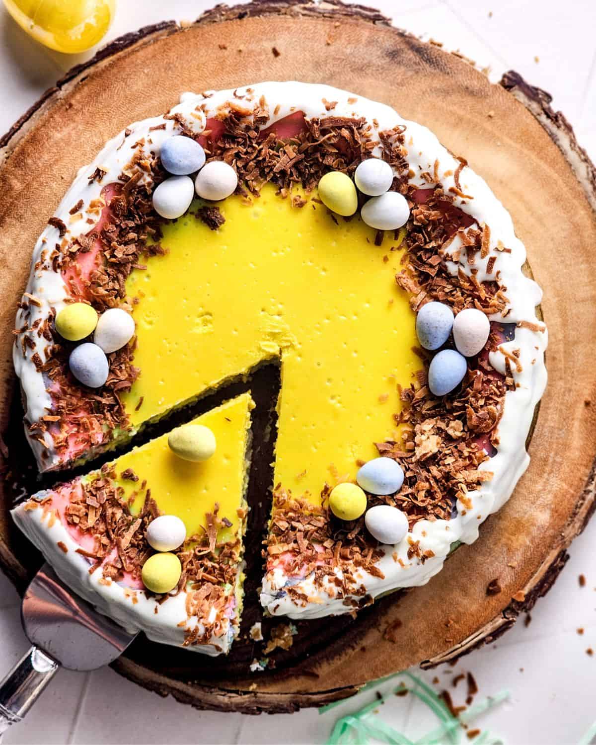 An Easter cheesecake on a wooden platter.