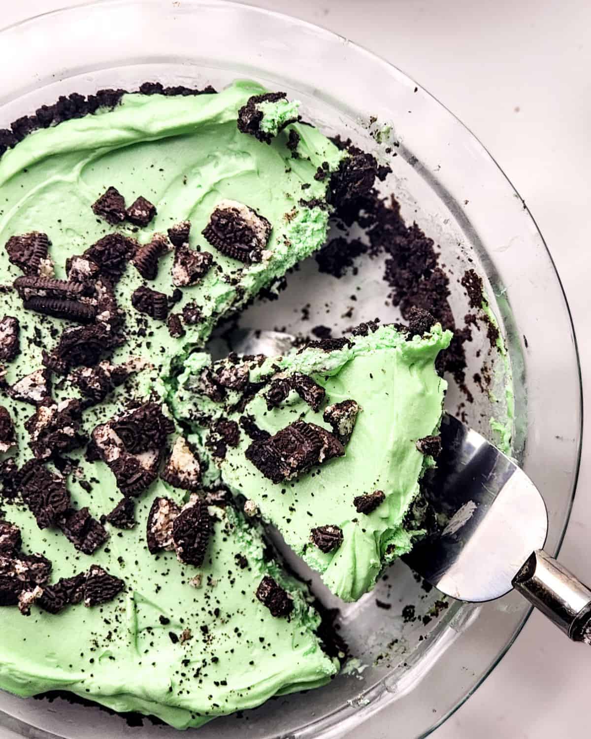 Mint Pie with a chocolate cookie crust in a glass pie plate.