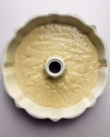A bundt cake with lemon bundt cake mix in the pan.
