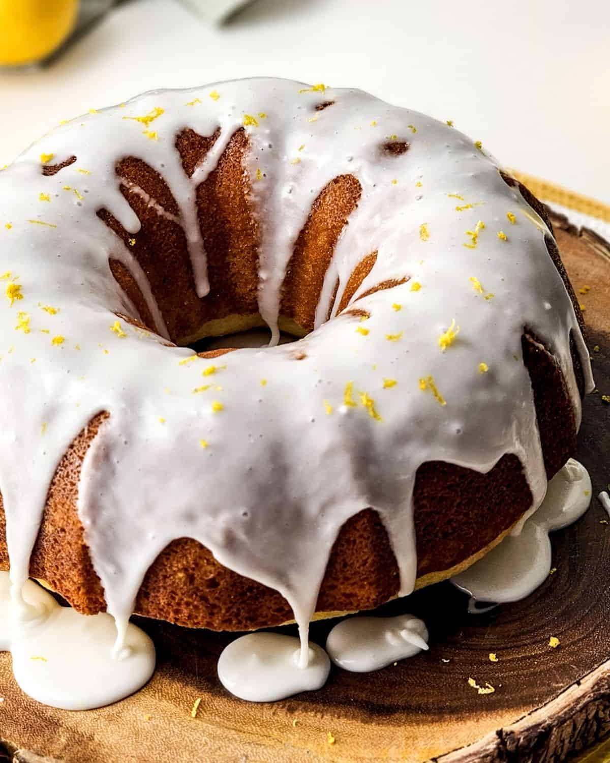 A lemon glazed bundt cake on a platter.