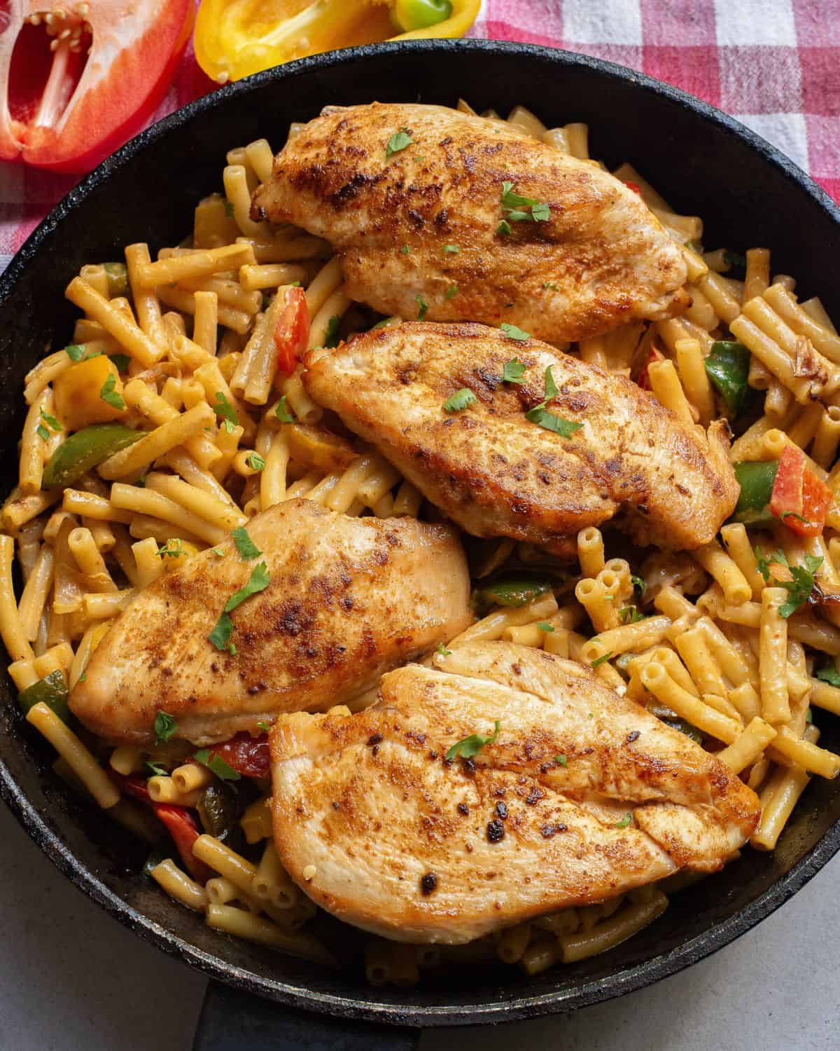 Chicken fajita pasta in a large saute pan.