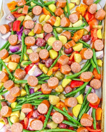 Sheet pan cajun sausage, potatoes, and veggies to make a sheet pan sausage dish.