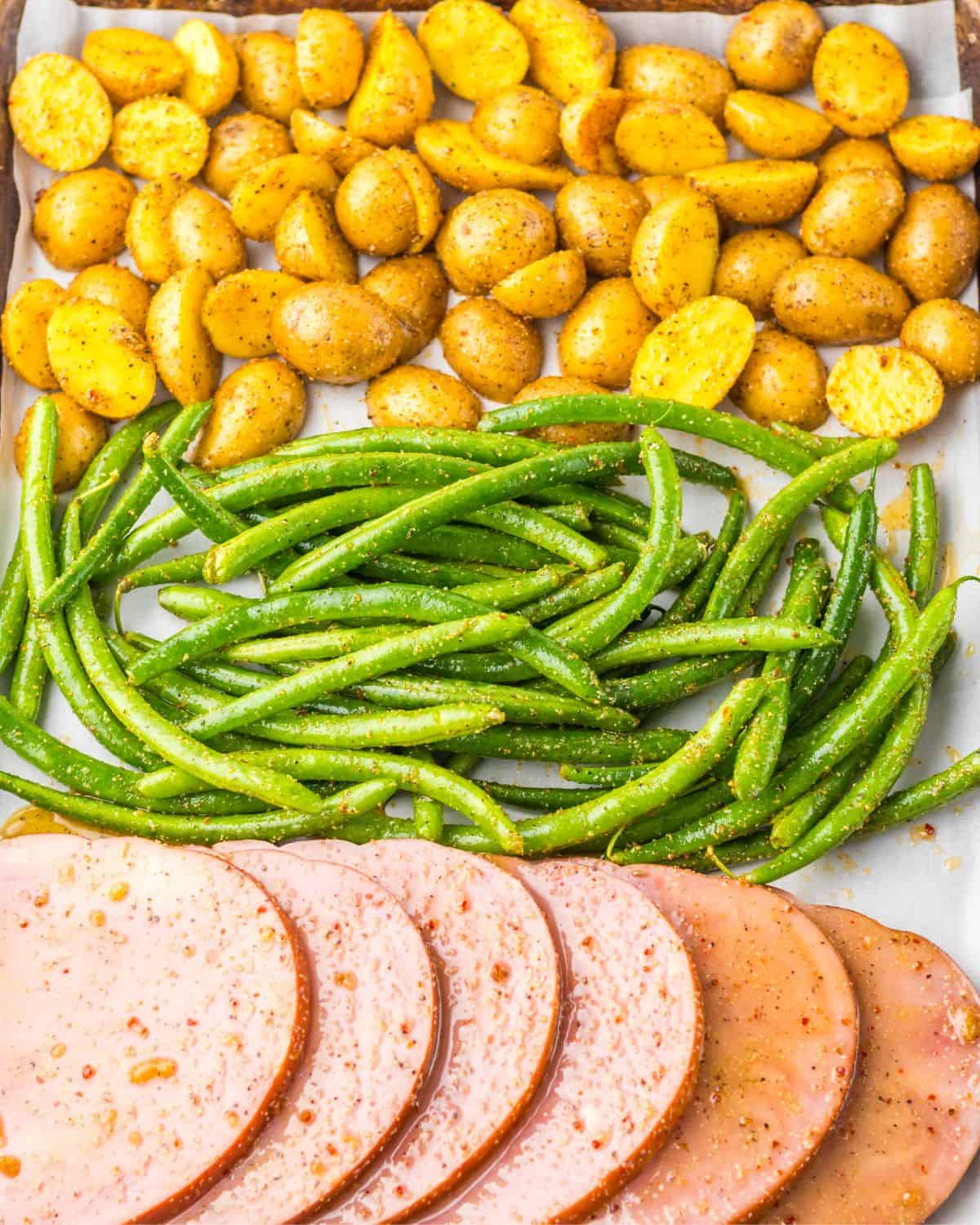 Sheet pan ham dinner with string beans and potatoes.