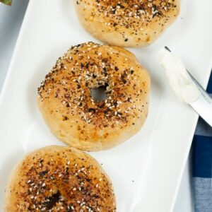 Air fryer bagels with everything seasoning on top of the bagels.