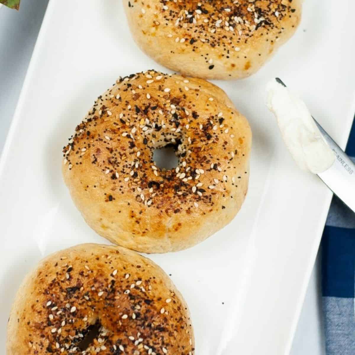 Air fryer bagels with everything seasoning on top of the bagels.