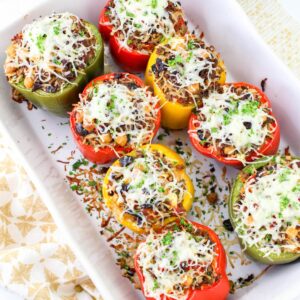 Greek stuffed peppers in a baking dish.