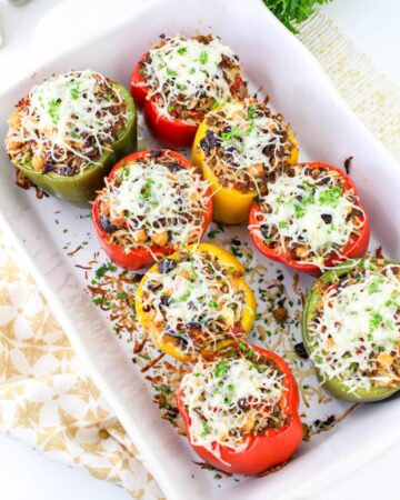 Greek stuffed peppers with chickpeas, beef, and rice topped with fresh mozzarella.