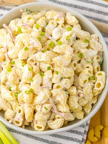 Homemade Hawaiian macaroni salad in a bowl with chopped scallions.