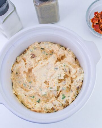 Jalapeno popper dip in a slow cooker.