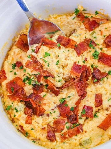 Jalapeno popper dip in a slow cooker.