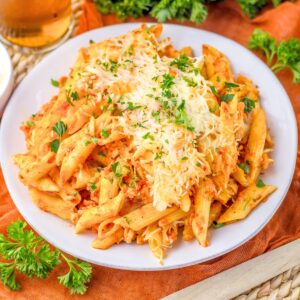 Chicken Parm Casserole plated and topped with chopped fresh parsley.