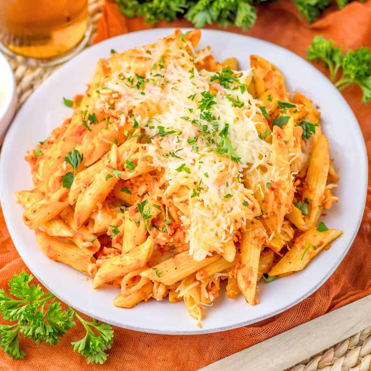 Chicken Parm Casserole plated and topped with chopped fresh parsley.