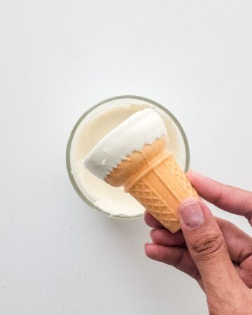 Waffle cones dipped in white chocolate.