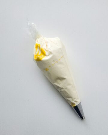 A piping bag with cheesecake mouse for a patriotic waffle cones.