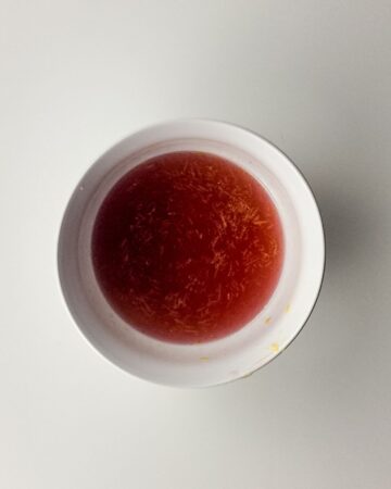 A bowl with concentrated lemonade to make rainbow sherbert. 