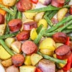 Sheet Pan Cajun Sausage and Potatoes recipe on a baking sheet.
