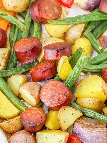 Sheet Pan Cajun Sausage and Potatoes recipe on a baking sheet.