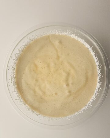 A mixture of whipped heavy cream and an egg mixture to make the base of salted caramel ice cream.