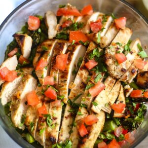 Grilled Chicken Asparagus Salad in a large glass bowl.