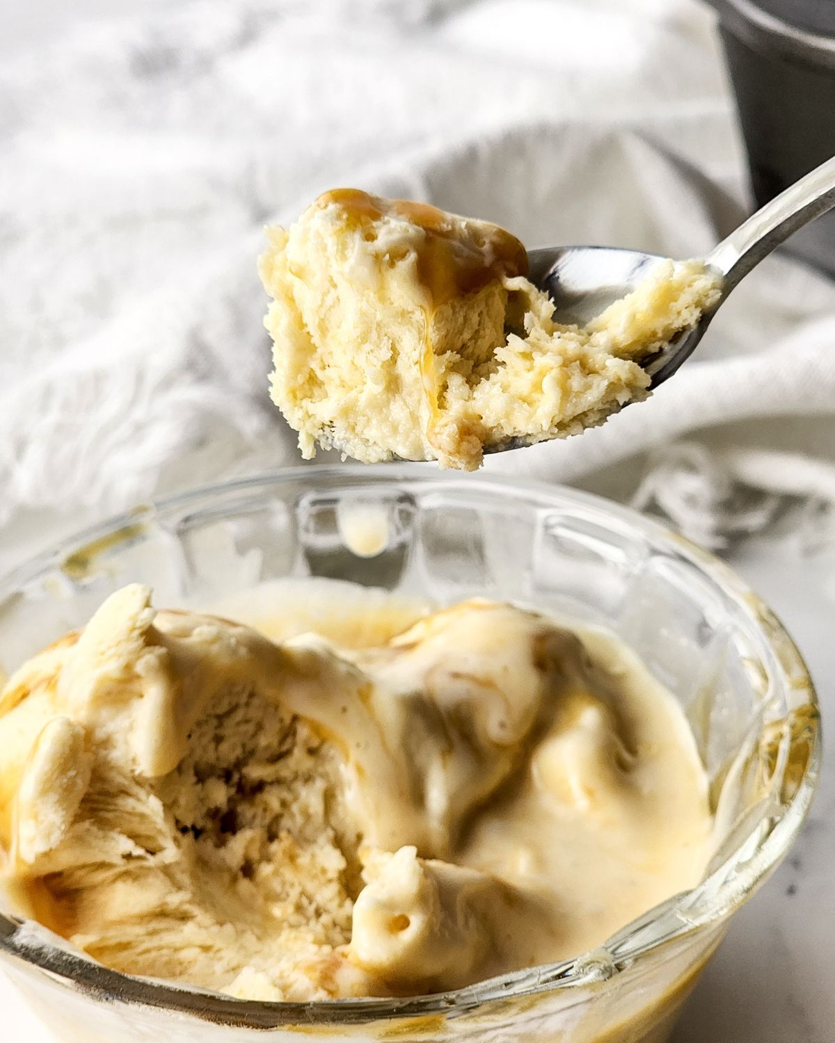 homemade ice cream with salted caramel on a spoon. 