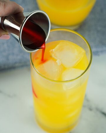 Add grenadine to a glass of tequila and orange juice to make a tequila sunrise. 
