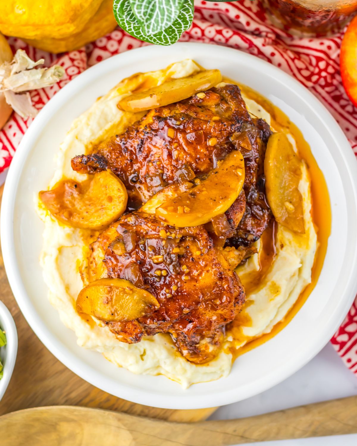 Apple cider braised chicken over mashed potatoes.