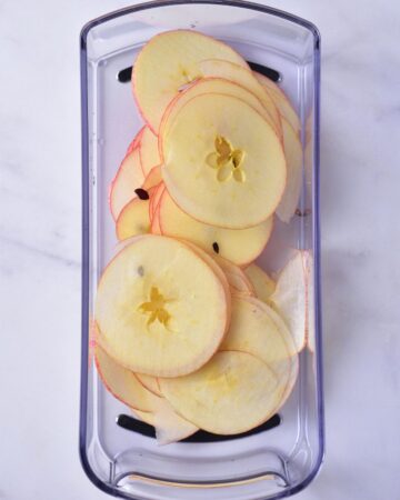 A bowl of sliced apples for baked apple chips.