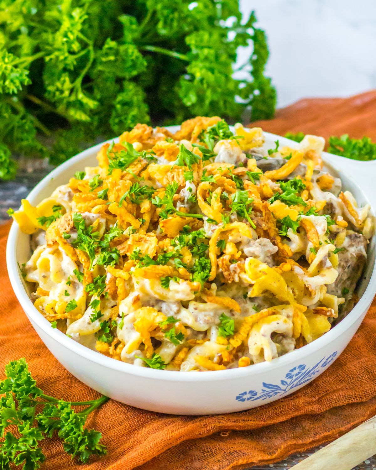 French onion beef casserole in a round bowl topped with fried french onions.