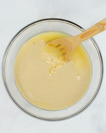 A large glass bowl with hummus made in a pressure cooker.