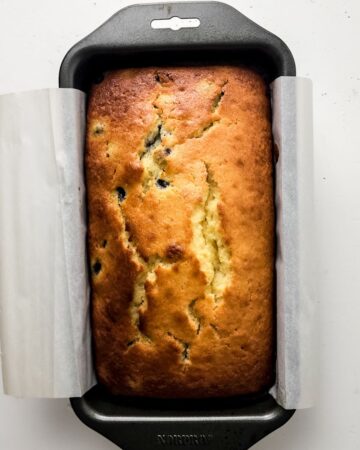A lemon blueberry loaf in a pan.