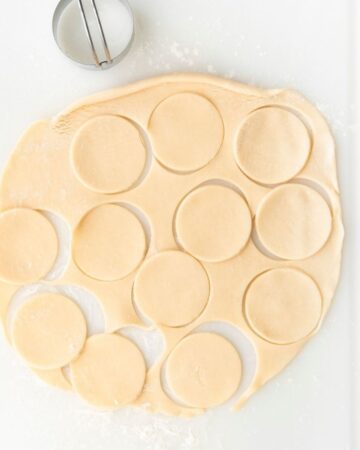 Pie crusts with circles cut to make mini quiche.