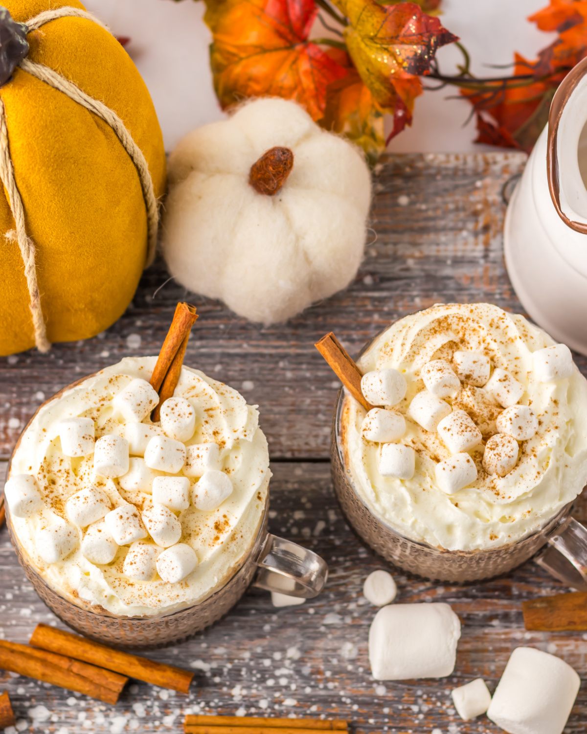 A pumpkin spice hot chocolate with marshmallows and whipped cream.