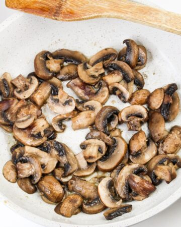 Sauteed mushrooms in a bowl to be added to beef  Bourguignon..