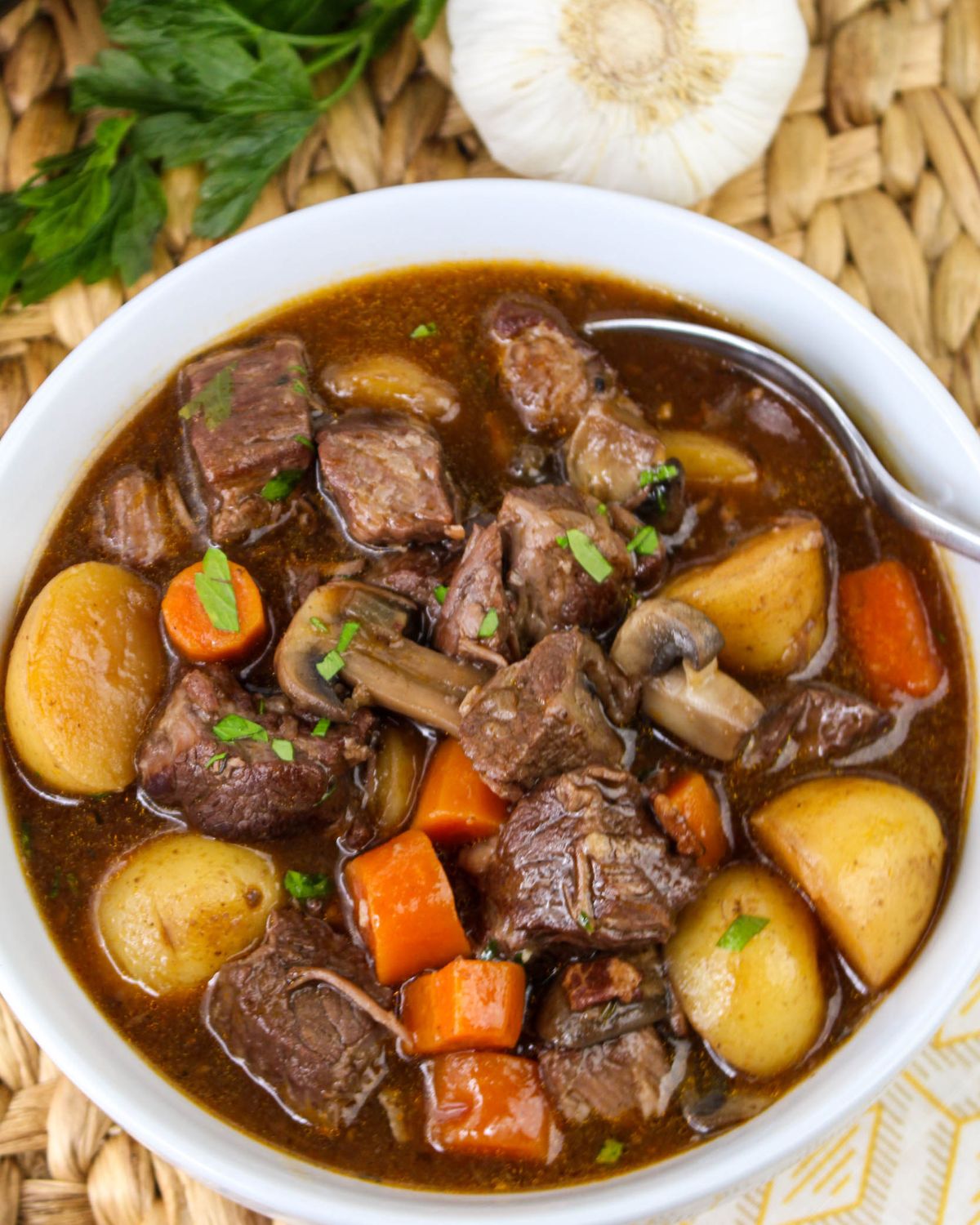 Instant Pot Beef Bourguignon in a bowl with potatoes and carrots.