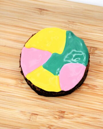 Pastel frosting on a brownie to make Halloween sally brownies. 