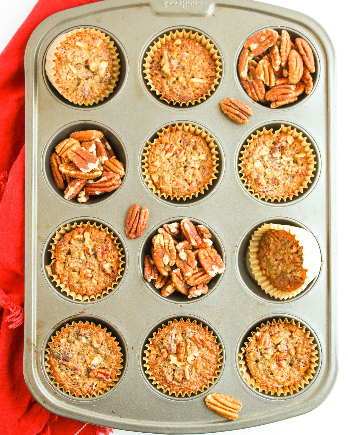 A muffin tin with pecan pie muffins.