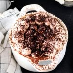 Pumpkin tiramisu in individual cocette ceramic bowls.