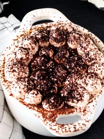 Pumpkin tiramisu in individual cocette ceramic bowls.