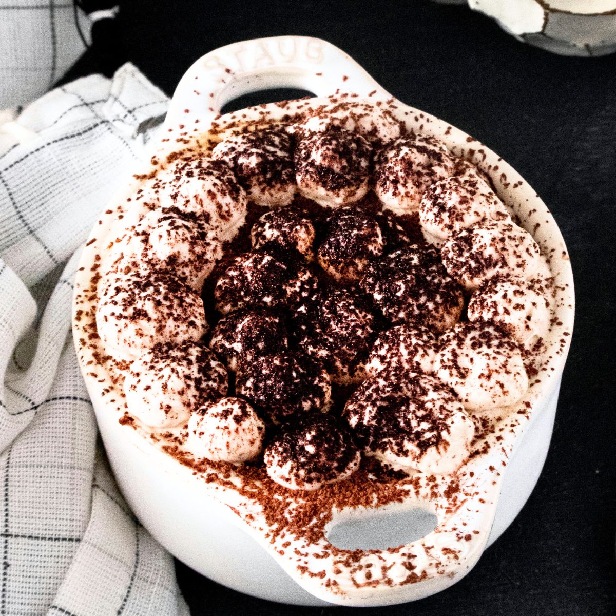 Pumpkin tiramisu in individual cocette ceramic bowls.