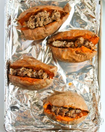Baked sweet potatoes stuffed with a butter pecan filling.
