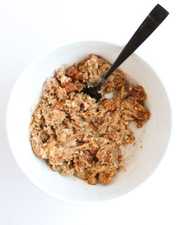 A bowl of softened butter, brown sugar, and pecans to stuff into sweet potatoes. 