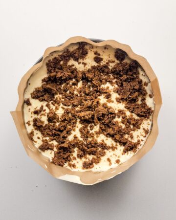 Cinnamon swirl cheesecake set up with a cinnamon swirl.