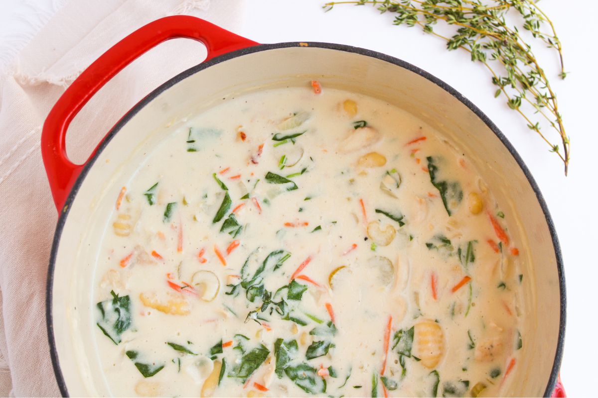 A Dutch oven with chicken gnocchi soup.