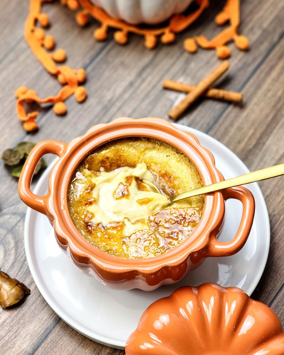 Pumpkin flavored creme brulee in a ramekin.