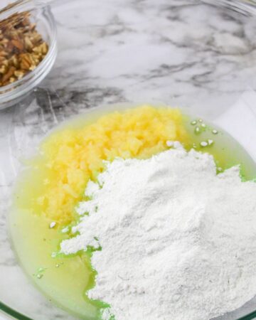 Ingredients to make a watergate salad in a glass bowl.