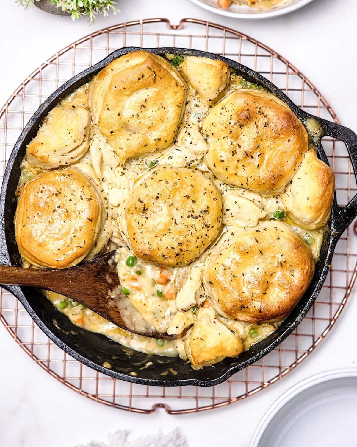 Homemade chicken pot pie made with biscuits.