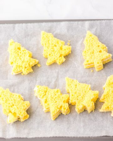 Cutout cake made into christmas trees to make christmas tree cakes. 