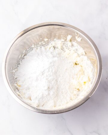 A large bowl with ingredients to make the filling for little debbie christmas cakes.